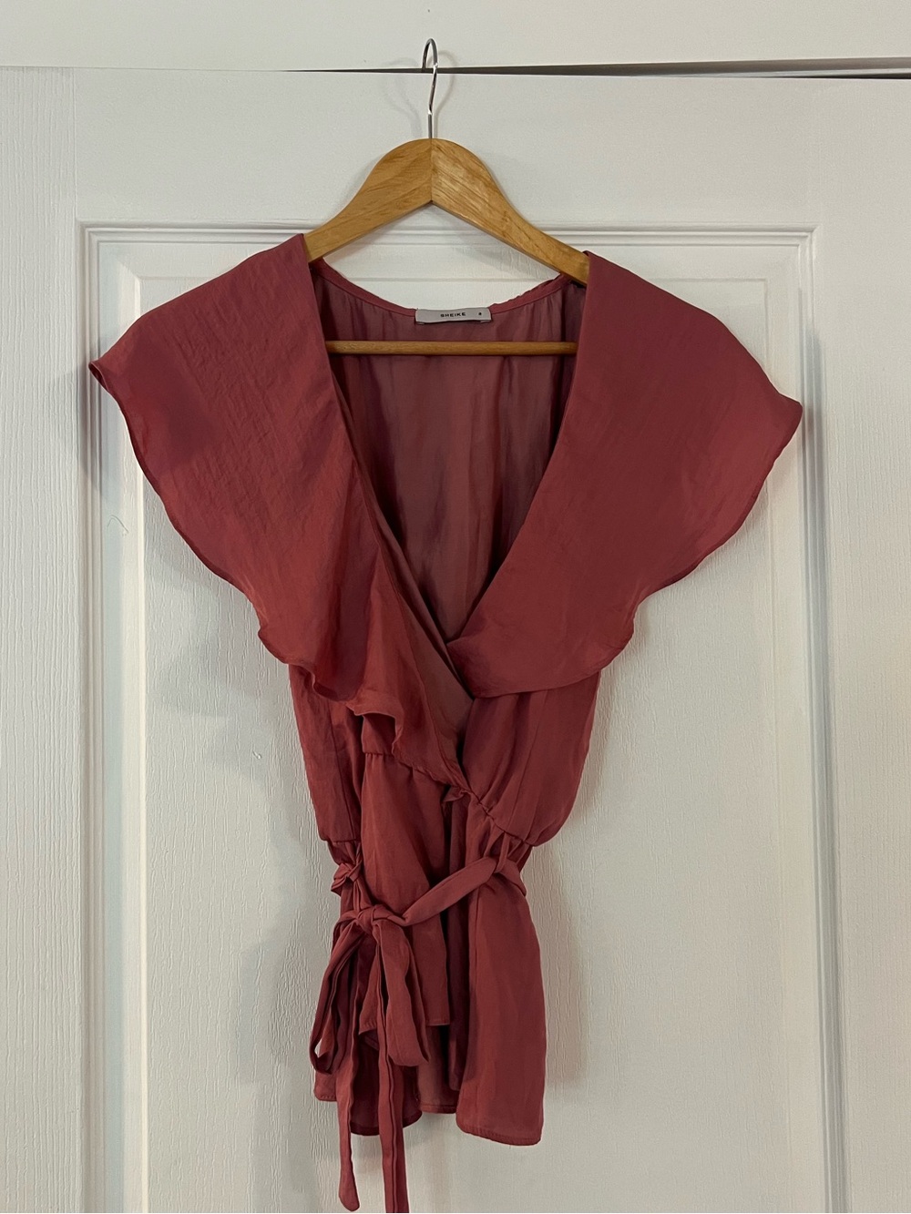 Sheike rose wrap top with flutter sleeves